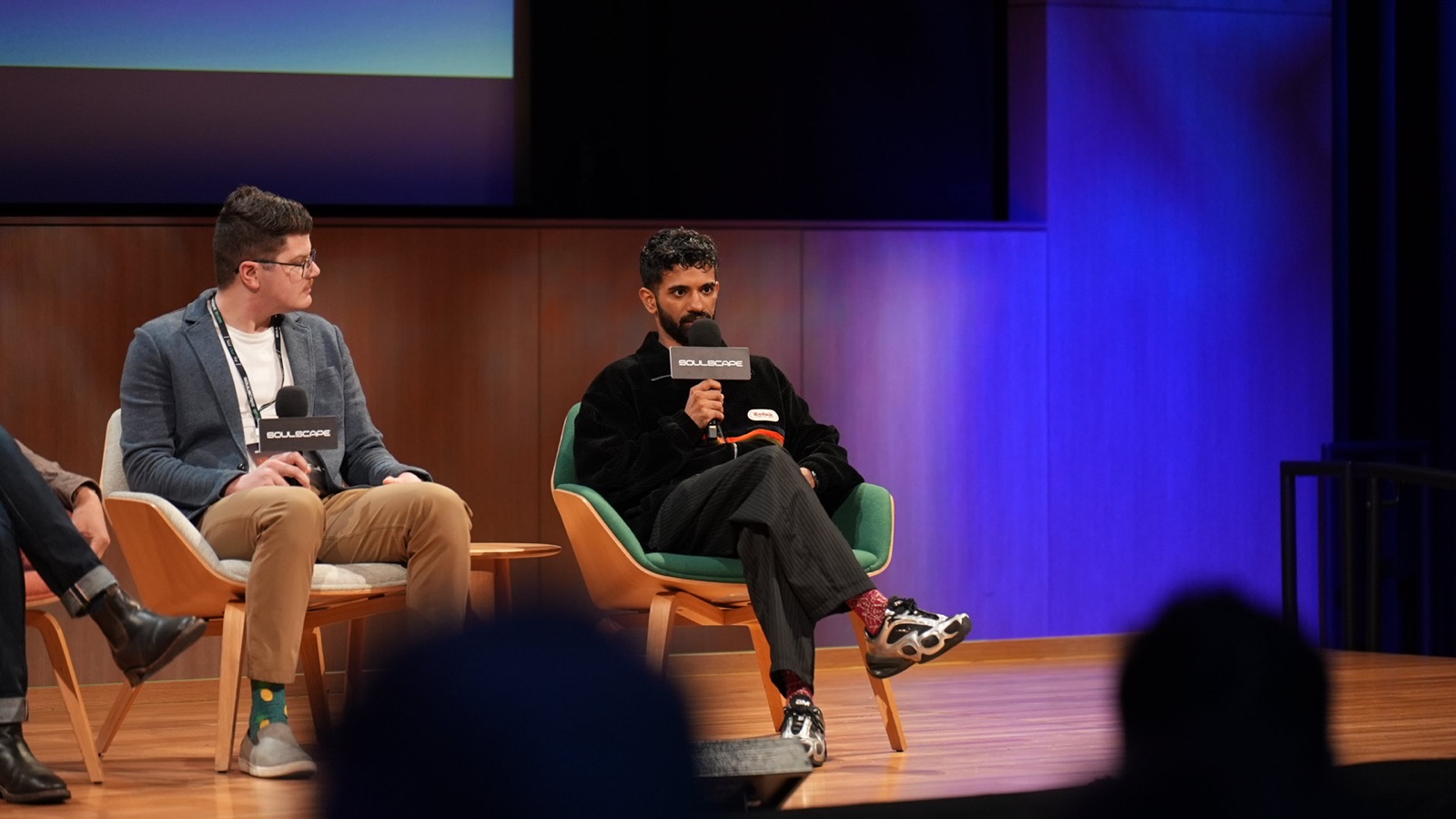 Panelists on the blue-lit Soulscape 2026 stage